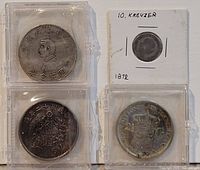 Obverse view of four coins in holders