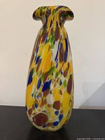 Front view of tall multicolour art glass vase