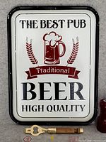 Front view of beer advertising sign and bottle opener