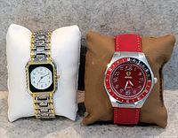 Front view of both watches on cushions