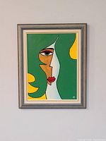 Full view of framed abstract oil painting on wall