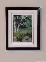 Framed watercolor landscape on wall, full view