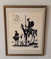 Framed Picasso Don Quixote print on wall showing full frame