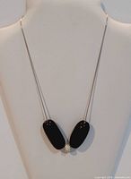 Full view of sterling silver necklace on display bust