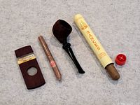 Full lot showing Cohiba wood cutter, wrapped cigar, tobacco pipe, Bances cigar tube with cap