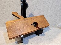 Left side view of wooden moulding plane showing throat and wedge