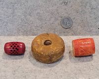 group shot of all three beads with quarter for scale
