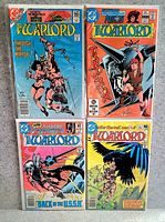 Front view of four bagged Warlord comics