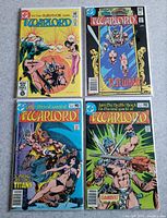 Group shot of four bagged The Warlord comics