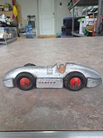 Left side profile showing overall body, driver, wheels