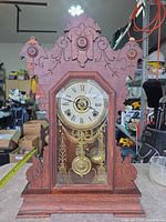 Full view of ornate Seth Thomas mantel clock on table