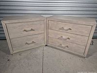 Front view of both matching pieces showing drawer fronts and pulls