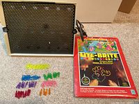 Lite-Brite unit, Wuzzles refill pack, loose pegs