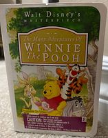 Front of card showing Winnie the Pooh artwork and series title