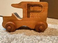 Left side view showing Pollock Trucks engraving and wheels