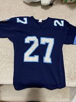 Front view of jersey showing number 27 and navy mesh fabric