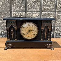 Front view of entire Sessions mantel clock showing case, dial, and feet