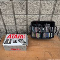 Console box and tray holding game cartridges