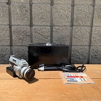 Camera, case, strap/cable and manual overview