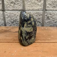 Front view of polished stone sculpture