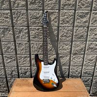 Full front view of Silvertone sunburst electric guitar
