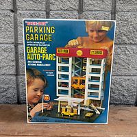 Front of original retail box showing parking garage artwork and branding