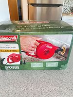 Retail box showing Coleman 120V QuickPump image and features