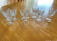Full grouping of four sizes of crystal stemware on table