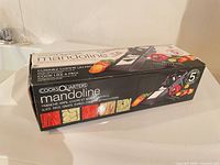 Retail box showing brand, model and images of sliced vegetables