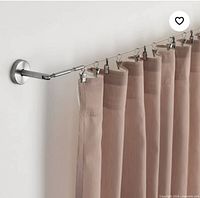 Rod set mounted on wall with curtain