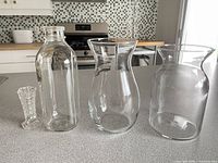 group shot of four clear glass items