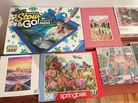 Overall view showing mat, Buffalo, Springbok, winter village, Fresh Air puzzles