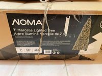 Box front showing NOMA branding, height, light count, diameter