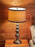 Single lamp lit showing shade and base