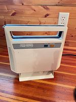 Front view of closed toaster showing brand, indicator lights, handle and exterior condition