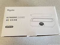 Retail box showing Rigate Ultrasonic Cleaner model reference