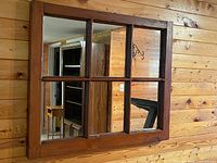 Front view showing six-pane mirror and wood frame