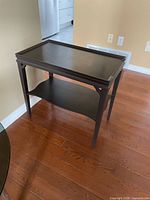 Full view of table showing top surface and lower shelf