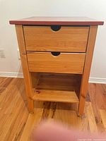 Front view showing full table with two drawers and shelf