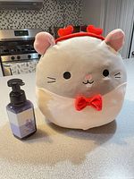 Front view showing overall appearance, bow tie, heart headband, scale reference