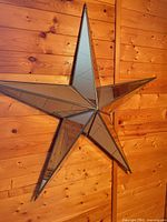 Full view of star mirror on wood wall