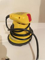 Full view of Sundance yellow orbital polisher with cord and pad
