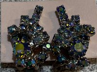 front view of rhinestone clip-on earrings showing cluster design and aurora borealis stones