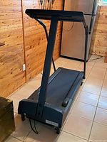 Full side view of treadmill folded down