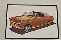 Box artwork featuring copper custom 1950 Ford convertible