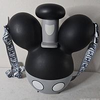 Front view of black and grey Mickey Mouse popcorn bucket with strap