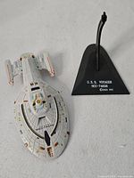 Model and stand side by side, showing size and stand components