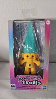 Front view of sealed Good Luck Trolls doll in window box