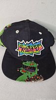 Front view showing Rugrats logo and Reptar graphic