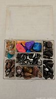 Organizer box open showing assorted polished stones